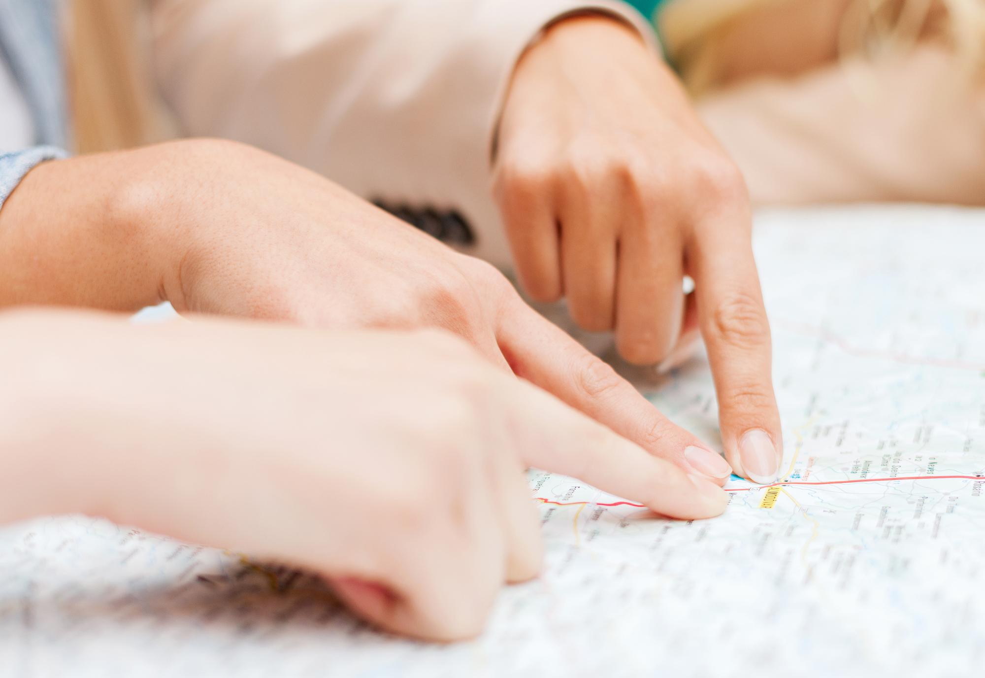 student stitching a geometric pattern under tutor guidance